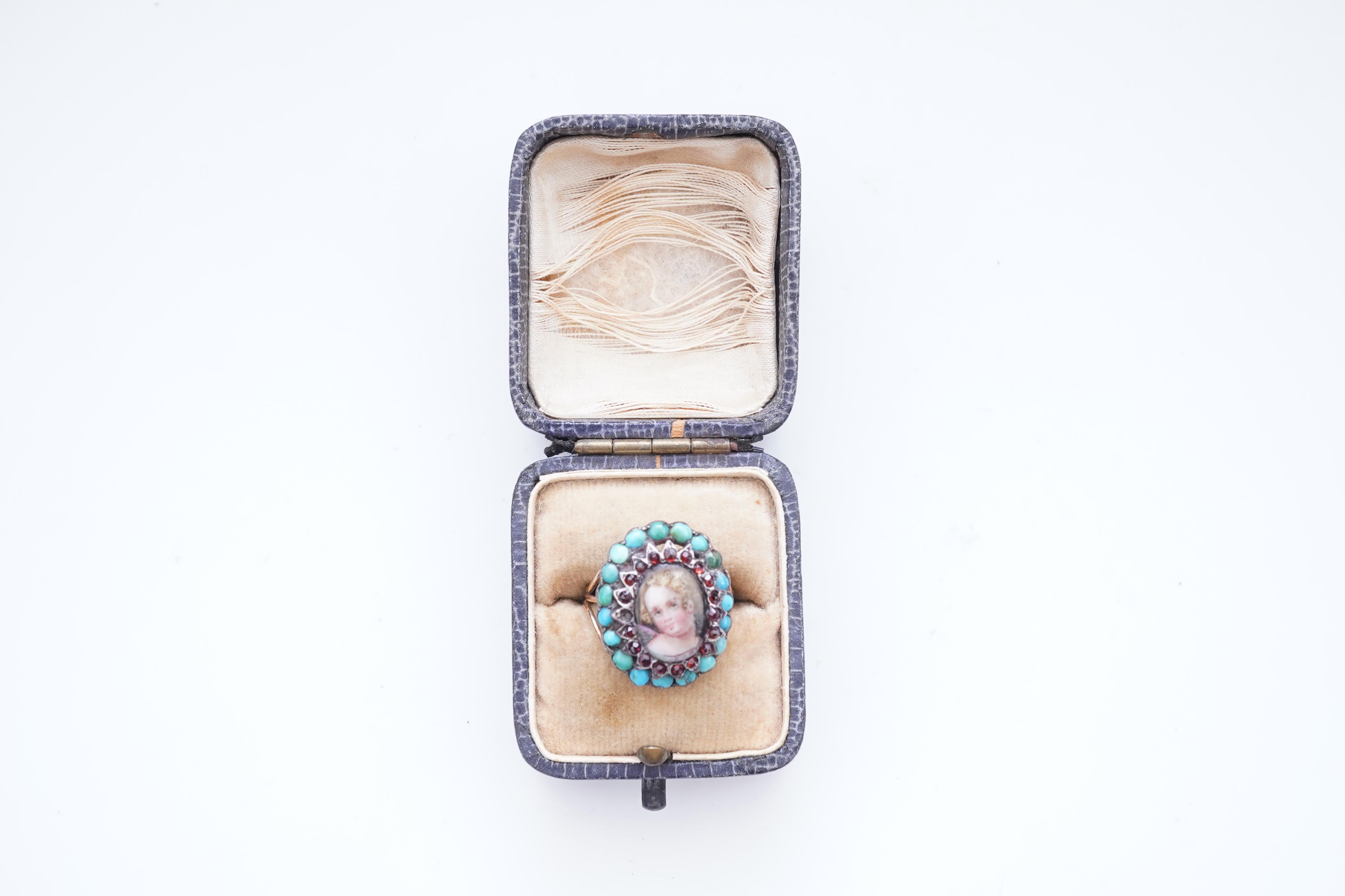 An enamel miniature, turquoise and garnet ring